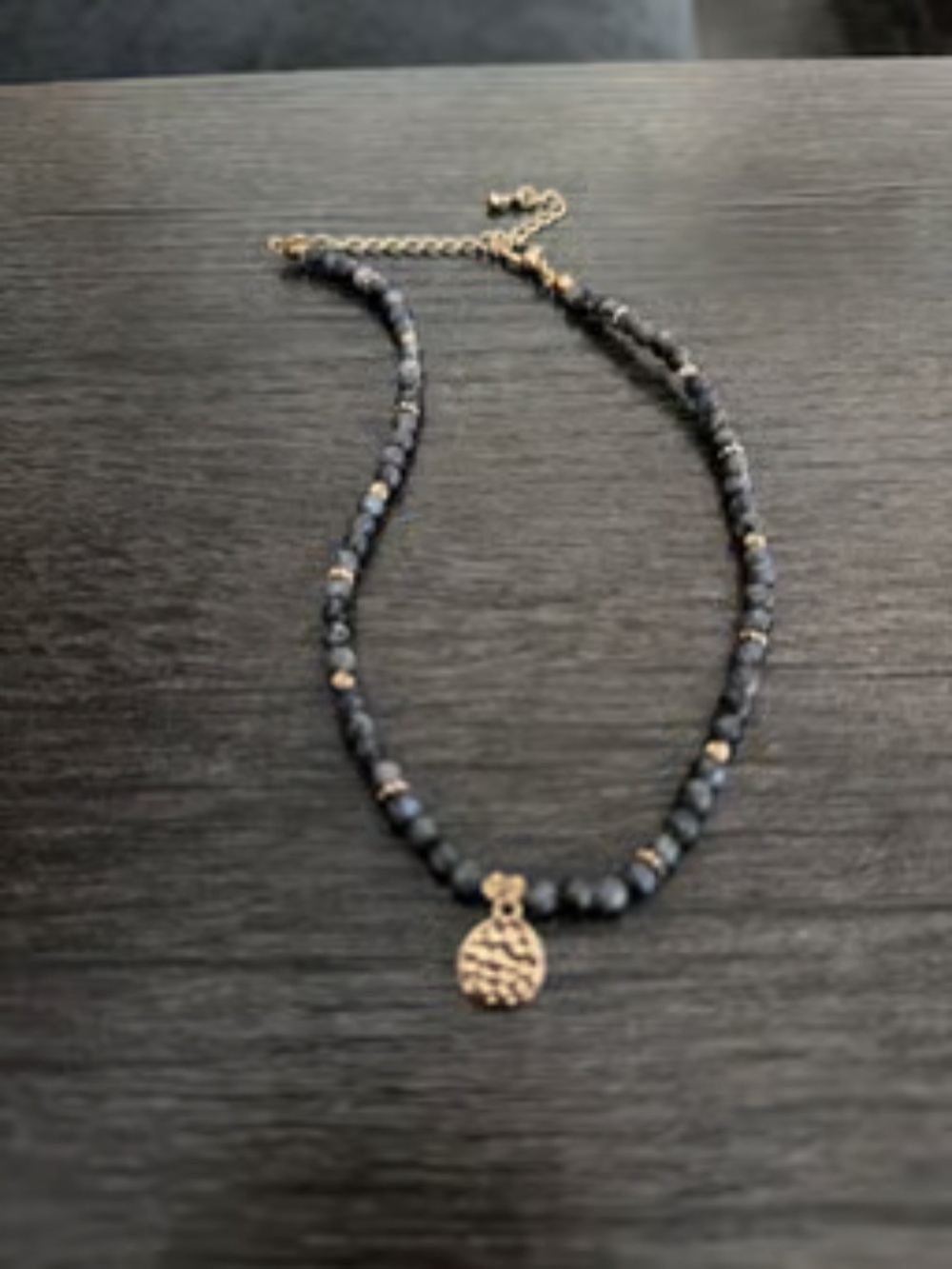 Adjustable beaded necklace with gold hammered medallion